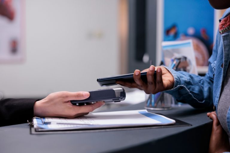 Patient,Using,Credit,Card,To,Pay,Checkup,Visit,With,Specialist,